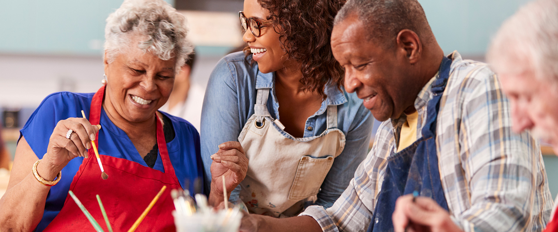 elderly people doing an arts and craft project - New Perspective Careers Assisted Living Careers