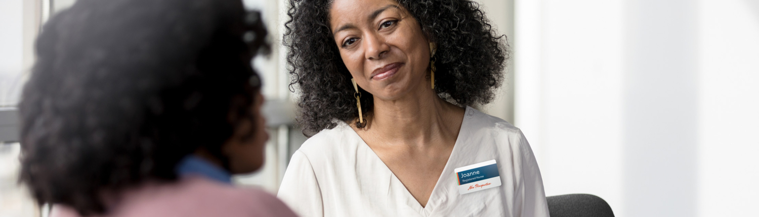 caretaker chatting with a patient - New Perspective Careers Assisted Living Careers