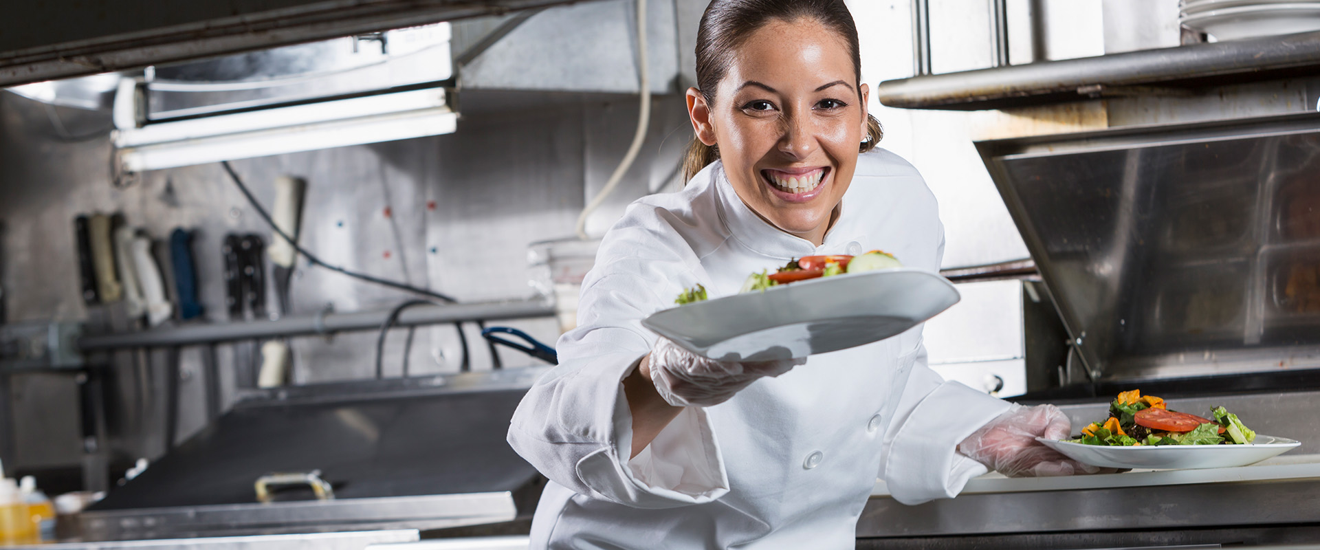 chef serving salads on white plates- New Perspective Careers Assisted Living Careers