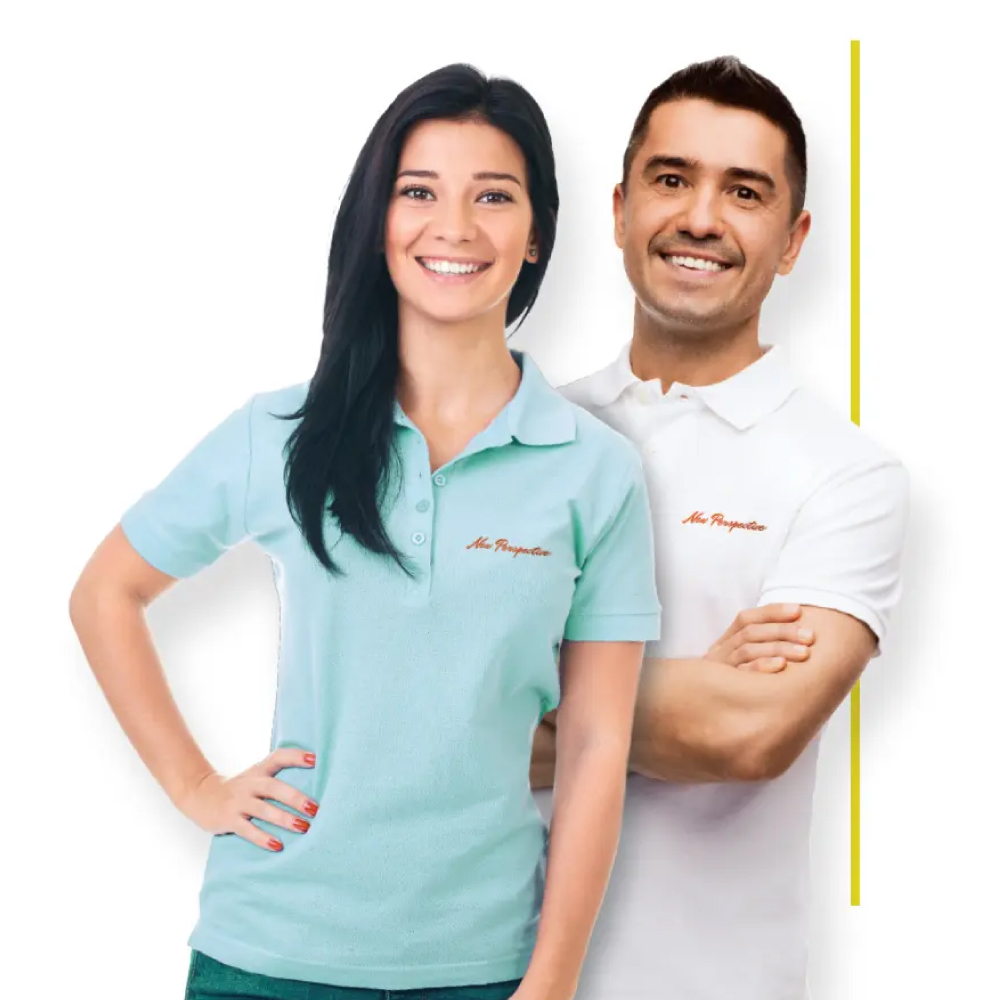 man and woman wearing collared shirts with New Perspective logo - New Perspective Careers Assisted Living Careers