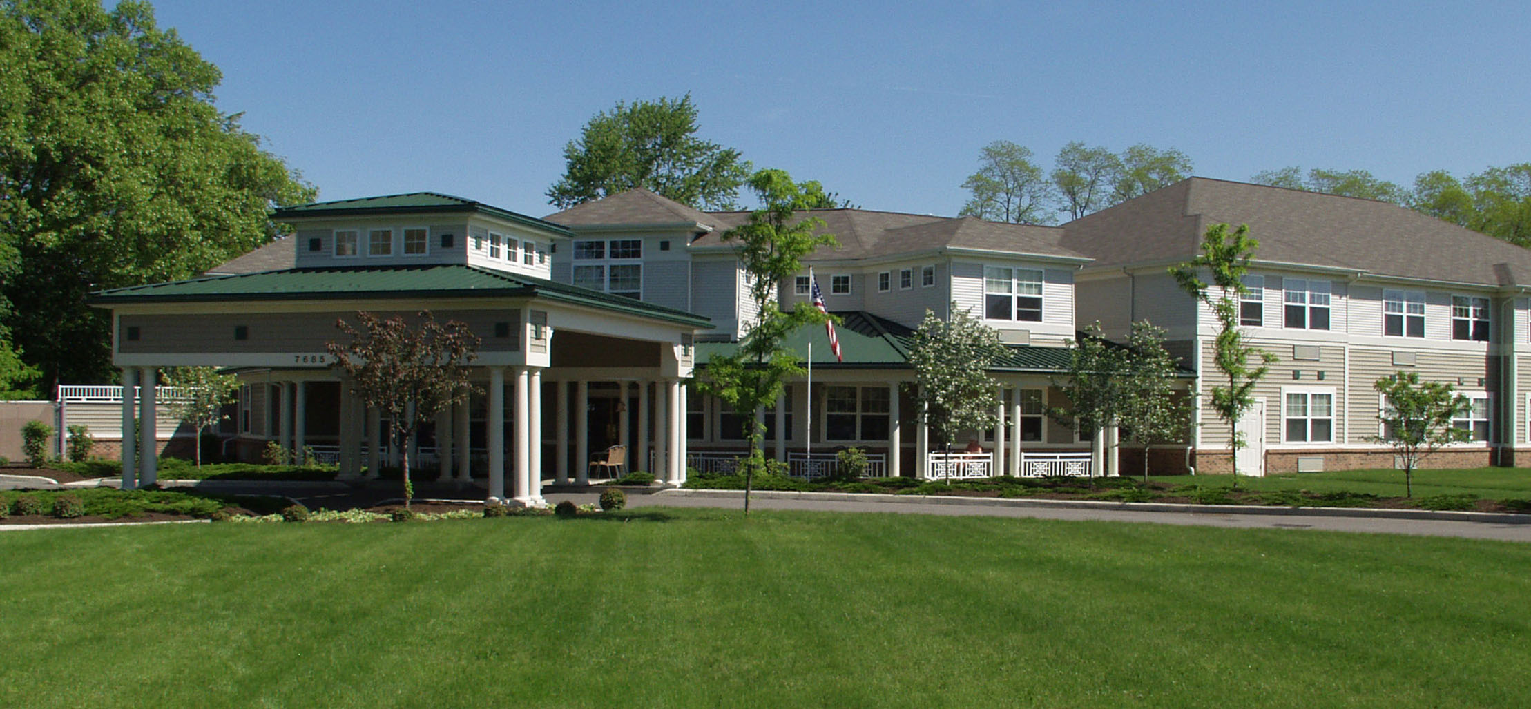 exterior of Salida facility with white columns and light brown siding - New Perspective Careers Assisted Living Careers