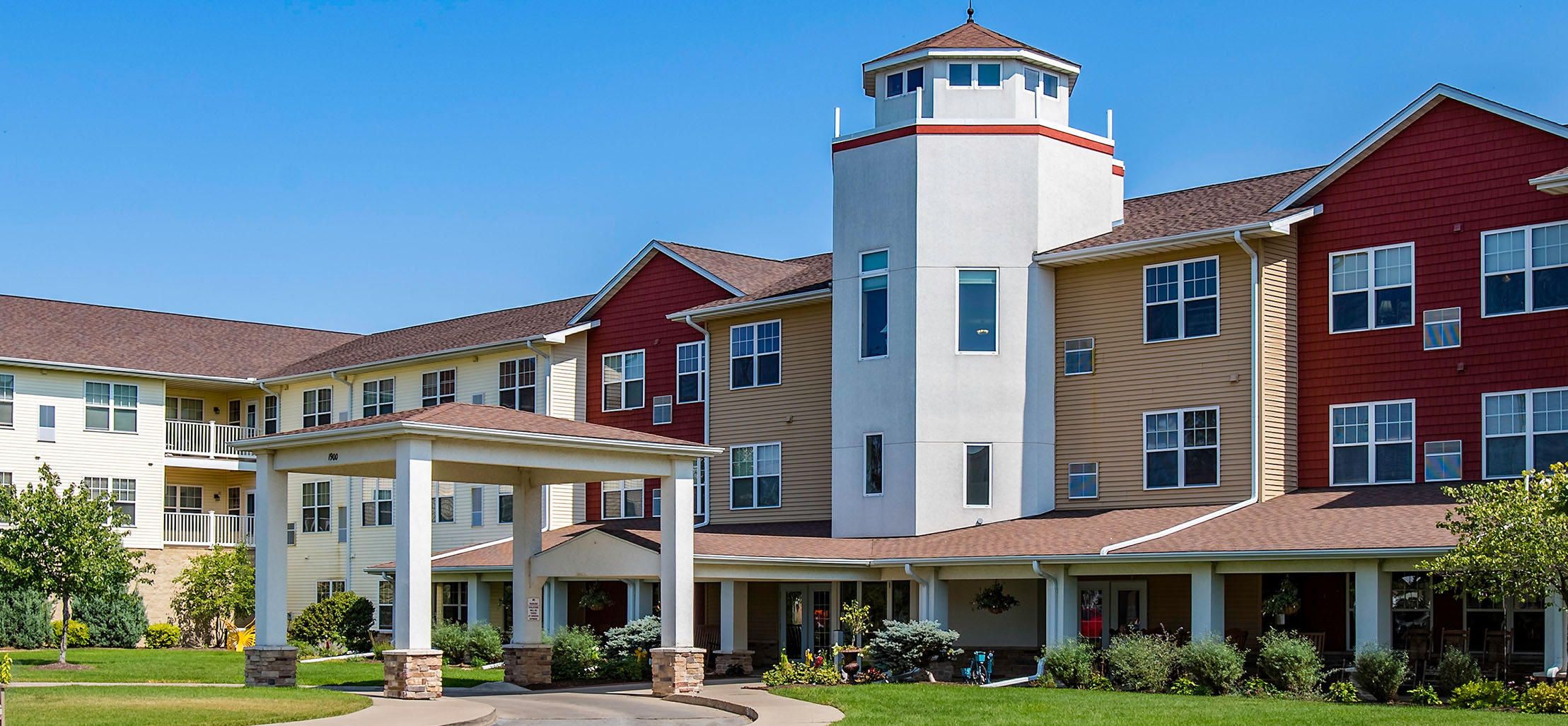 exterior of Silvis facility with red and yellow siding - New Perspective Careers Assisted Living Careers