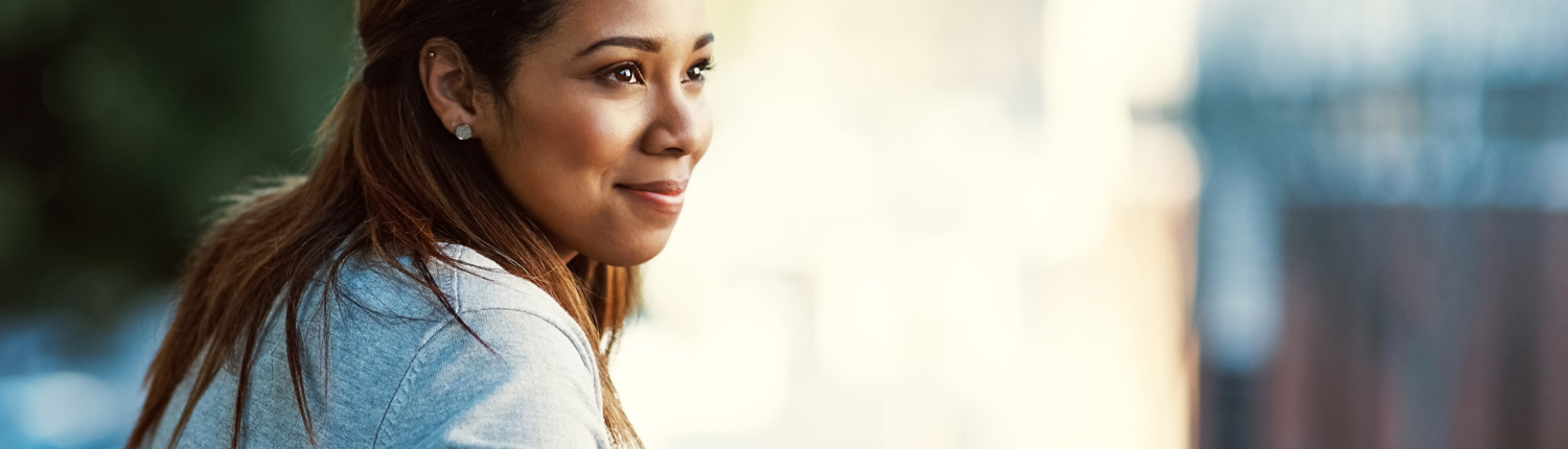 woman with diamond earrings looking in the distance - New Perspective Careers Assisted Living Careers