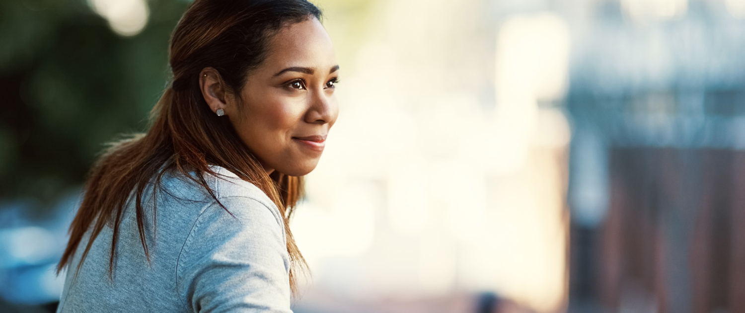 woman with diamond earrings looking in the distance - New Perspective Careers Assisted Living Careers