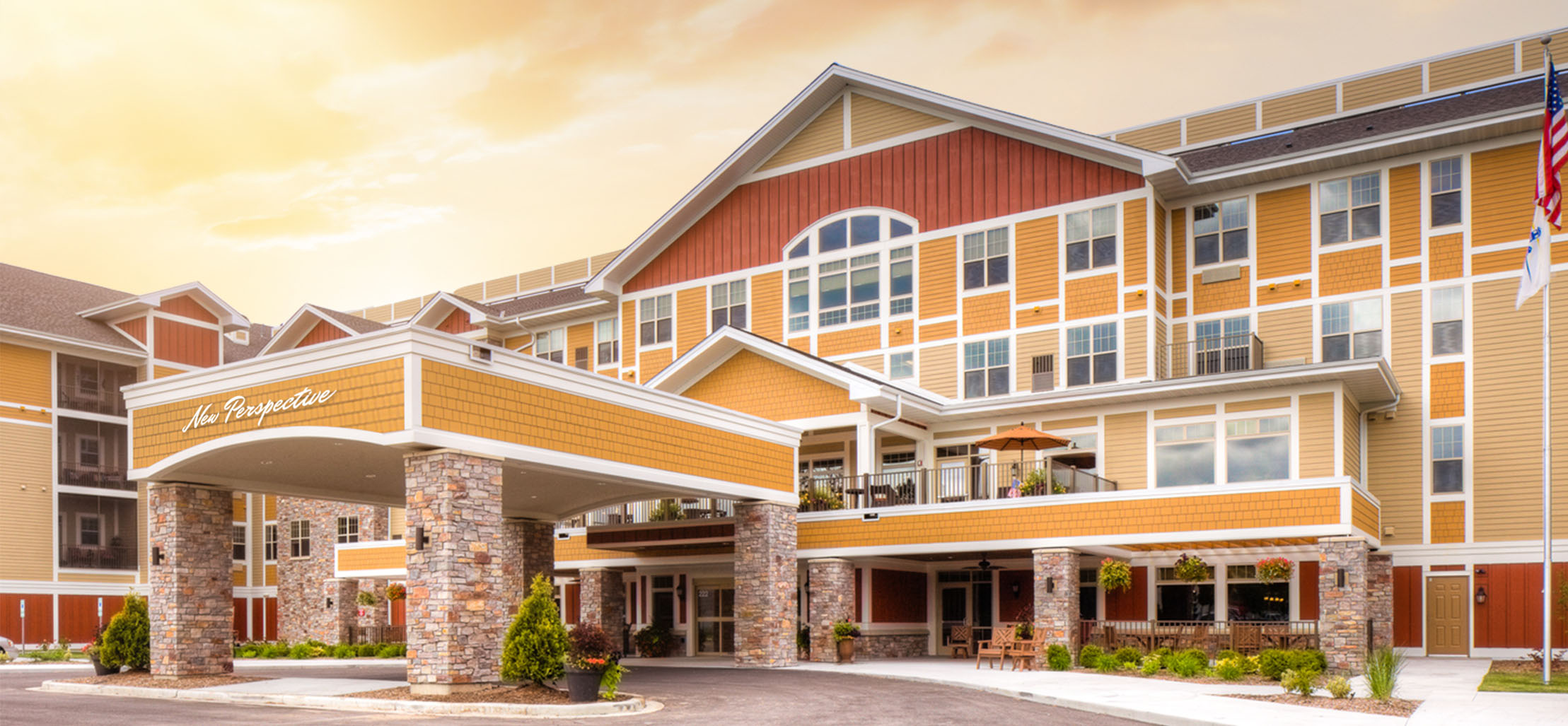 exterior of Sun Prairie facility with stone and yellow siding - New Perspective Careers Assisted Living Careers