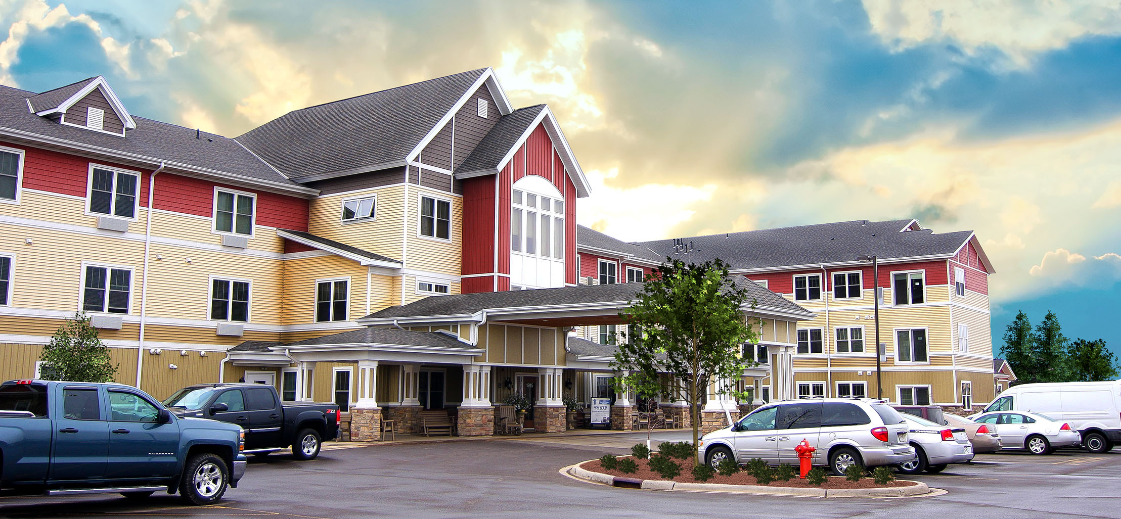 exterior of Twin Ports facility with stone and red siding - New Perspective Careers Assisted Living Careers