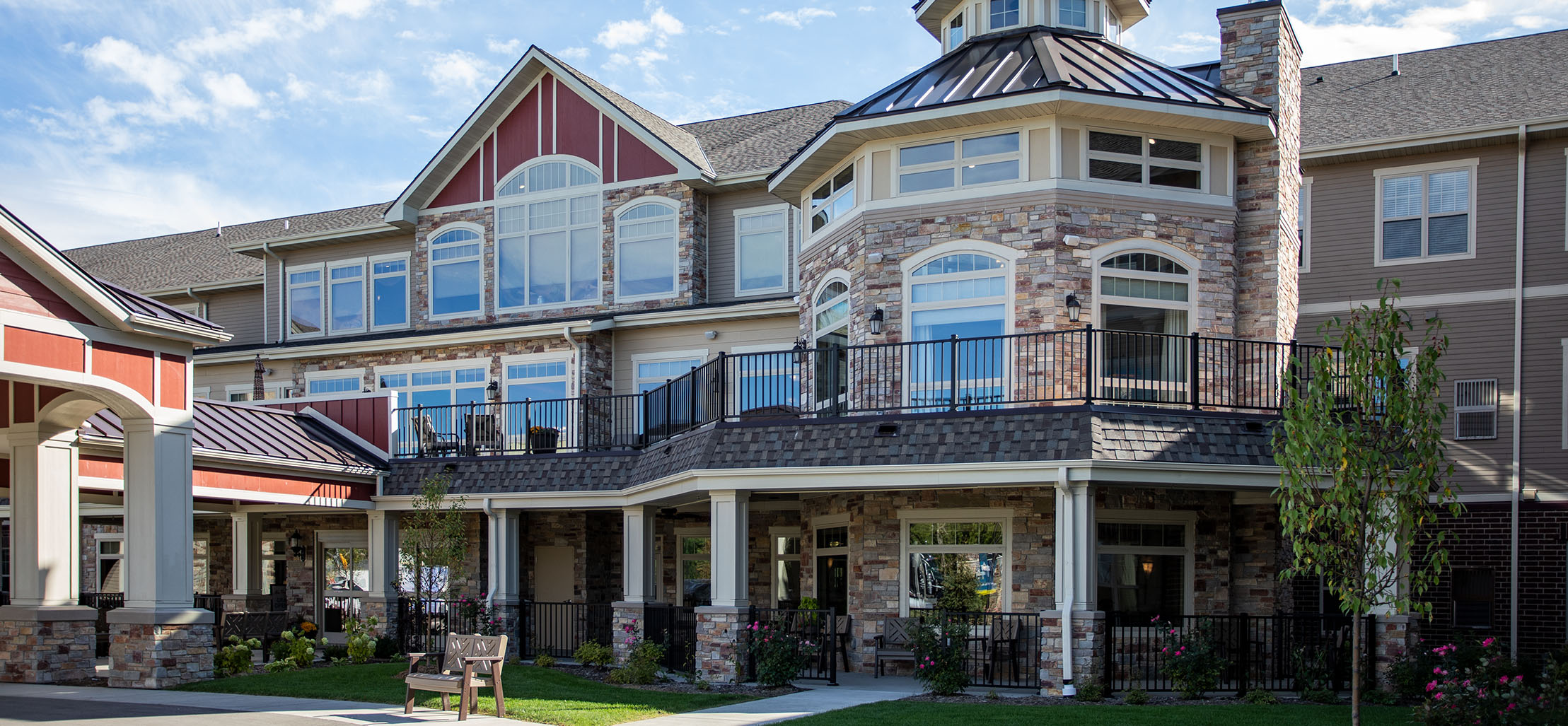 exterior of Waukesha facility with stone and red siding - New Perspective Careers Assisted Living Careers